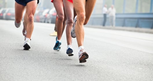 Action shot of people running in city marathon