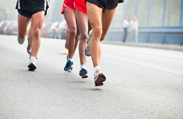 Action shot of people running in city marathon